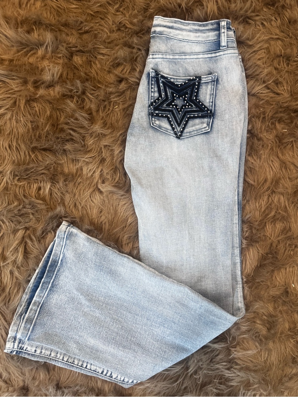 Western light washed denim with large blue stars on pockets boot cut stretch